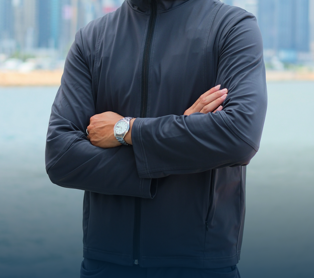 Person wearing vest with arms crossed